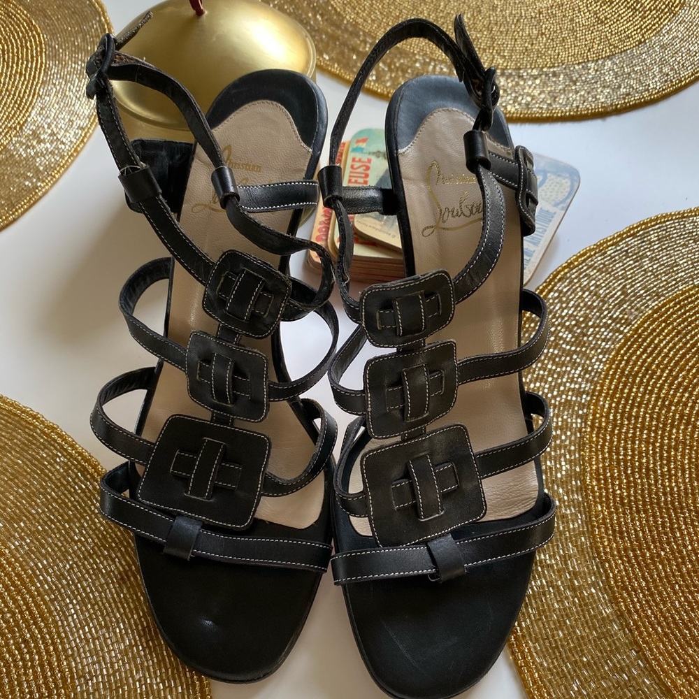 Christian Louboutin black heeled sandals.